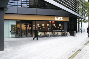 architecture, cafe, dark, England, eye level view, facade, London, overcast, pavement, plaza, square, The United Kingdom, tree, urban