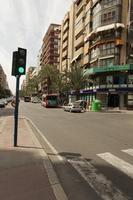 Alicante, bus, car, day, eye level view, natural light, Spain, street, sunny, traffic light, Valenciana