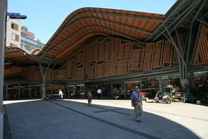 Barcelona, canopy, Cataluña, day, direct sunlight, eye level view, facade, man, people, scooter, shopping centre, Spain, spring, summer, sunny