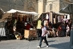 bicycle, casual, clothing, day, eye level view, Florence, Italia , man, market, natural light, stall, standing, street, summer, sunlight, sunny, sunshine, Toscana, vendor, walking