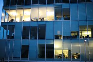 artificial lighting, building, dusk, England, evening, eye level view, facade, glass, London, office, spring, The United Kingdom