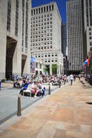 bollard, building, crowd, day, eye level view, facade, Manhattan, New York, people, sitting, street, summer, sunny, The United States