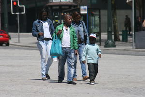 African, afrocarribean, casual, day, direct sunlight, eye level view, family, group, people, Porto, Porto, Portugal, spring, street, sunny, walking