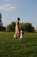 African, afrocarribean, afternoon, day, England, eye level view, family, London, lowered, mother and child, park, side, spring, sunny, The United Kingdom, walking