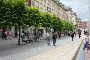 Amiens, bench, bicycle, day, eye level view, France, group, man, overcast, pavement, Picardie, shopping, street, tree, walking, woman