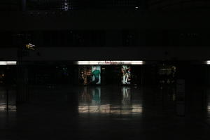 airport, artificial lighting, eye level view, indoor lighting, Madrid, reflected, retail, shop, shopfronts, Spain