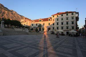 building, cafe, Croatia, dusk, evening, eye level view, family, group, Makarska, pavement, people, plaza, Splitsko-Dalmatinska, steps, tourist, tree, vegetation