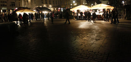 artificial lighting, crowd, eye level view, Krakow, Malopolskie, market, night, pavement, people, Poland, square, winter