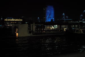 artificial lighting, city, city, city lights, cityscape, England, eye level view, London, night, restaurant, river, riverbank, spring, The United Kingdom, tower, urban